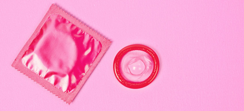Розовый презерватив